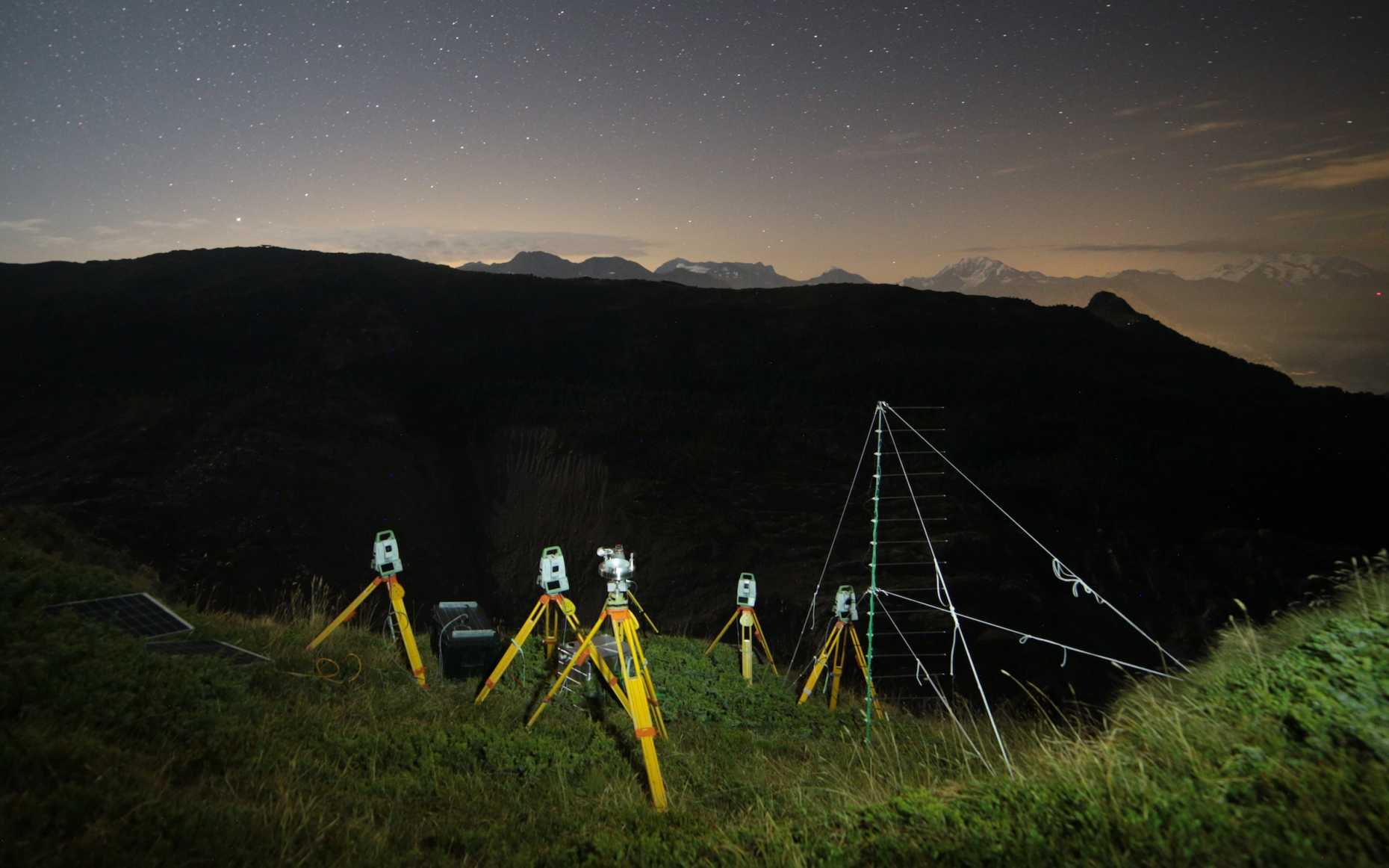 Image of several total stations in the night